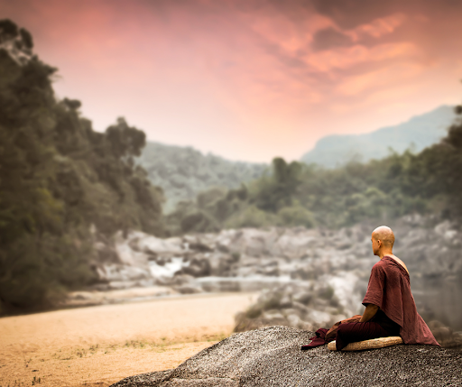 A monk chanting alone for protection