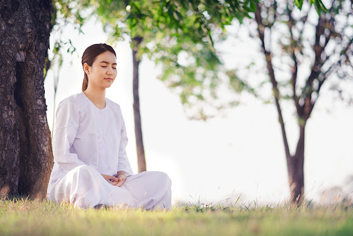 a woman practicing clear skin meditation