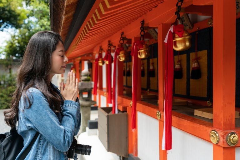 Image of a girl performing buddhist prayer