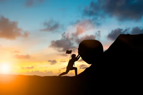 A person pushing hard to achieve his goals