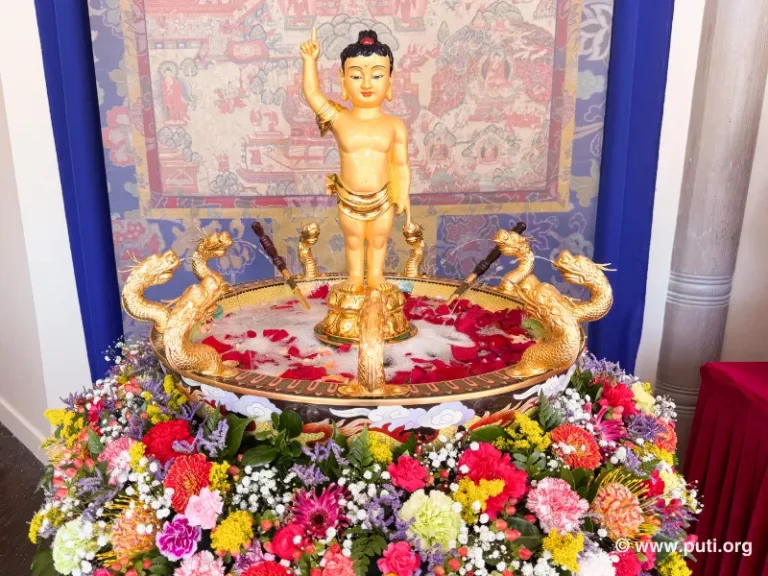 The golden-glowing statue of Prince Siddhartha symbolizes wisdom and compassion