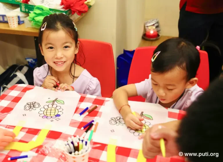 Children displaying their creative artwork